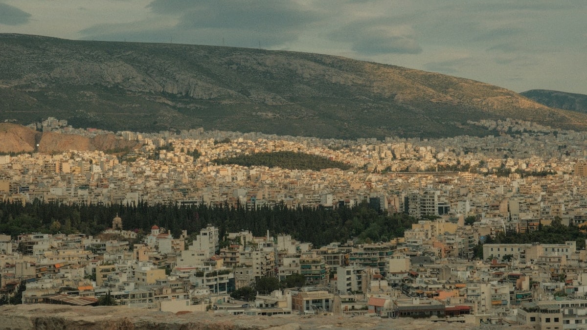 a view of a city with mountains in the background